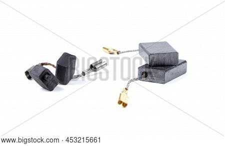 New And Old Carbon Brushes Isolated On A White Background. Brushes For Electric Motor.spare Parts Fo