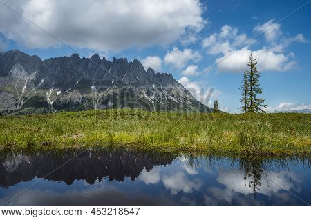 Mountain Pond With Wilder Kaiser Range Reflecting In Water Pond, Tirol - Austria