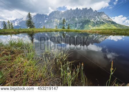 Mountain Pond With Wilder Kaiser Range Reflecting In Water Pond, Tirol - Austria