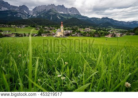 Yellow Local Church In Ellmau. Village Of Going. Wilden Kaiser Mountains In Background. Tirol, Alps,