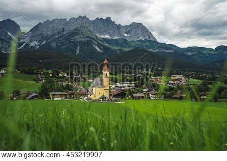 Yellow Local Church In Ellmau. Village Of Going. Wilden Kaiser Mountains In Background. Tirol, Alps,