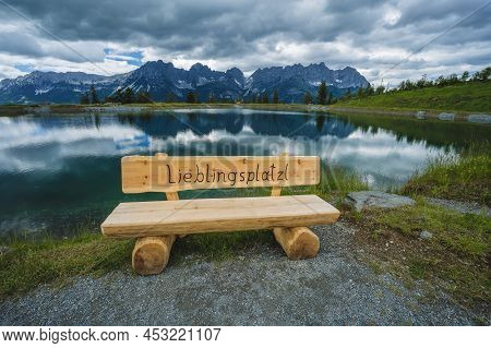 Astberg Lake Benach With Darling Little Place Phrase. Wilderkaiser Mountains In Background. Ellmau, 