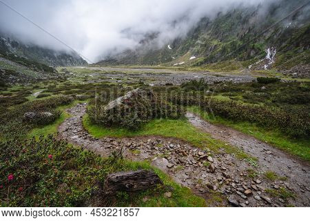 Summer View Of Alpine Mountain Valley With Winding Stream And Glacial Lake. Sulzenau Alm, Stubai Alp