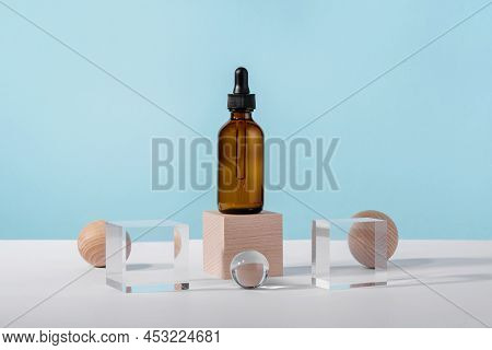 Oil Cosmetics Amber Product Packaging With Stylish Props. Serum Cosmetic Bottle With Peptides And Re