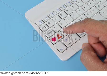 Laptop Keyboard With Love And Scammer Symbols. Online Dating Scam And Love Scam Concept.