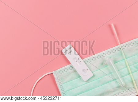 Top View Or Flat Lay Of Covid-19 Negative Test Result Antigen Test Kit (atk)  With A Nasal Swab And 