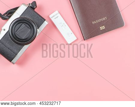 Top View Or Flat Lay Of Covid-19 Negative Test Result Antigen Test Kit (atk) , Camera And  Passport 