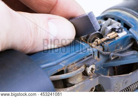Carbon Brushes Isolated On A White Background. Brushes For Electric Motor.spare Parts For Angle Grin