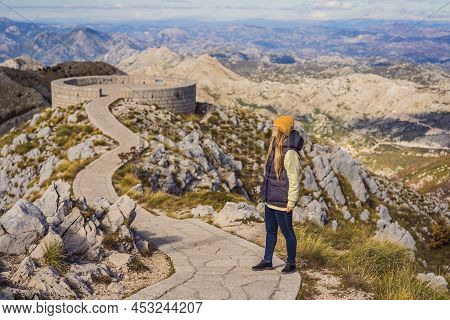 Woman Traveller In Mountain Landscape At National Park Lovcen, Montenegro. Travel To Montenegro Conc