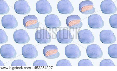 Pattern From Japanese Rice Cakes With Blue Matcha. A Conceptual Composition Mochi On A Blue Backgrou