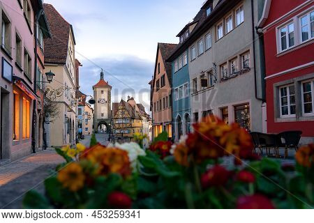 Romantic Rothenburg Ob Der Tauber In The Evening With Springflowers