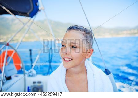 Little Boy On Board Of Sailing Yacht On Summer Cruise. Travel Adventure, Yachting With Child On Fami