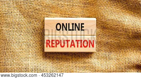Online Reputation Symbol. Wooden Blocks With Concept Words Online Reputation On Beautiful Canvas Bac