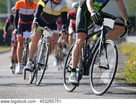 Many Cyclists Ride On The Racing Bikes During The Road Cycling Race In The City