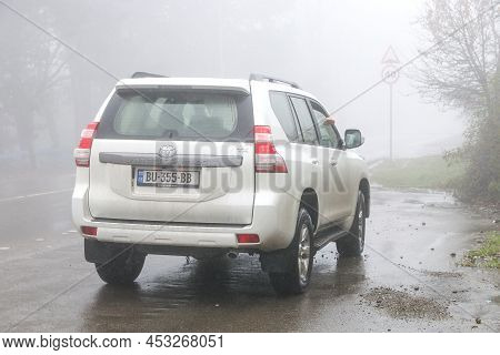 Kvemo Kartli, Georgia - October 8, 2021: White Offroad Car Toyota Land Cruiser Prado 150 At An Inter