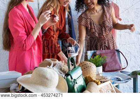 Happy Women At Swap Party. Choose Casual Clothes, Shoes, Hats, Bags, Jewellery. Idea Of Exchange You