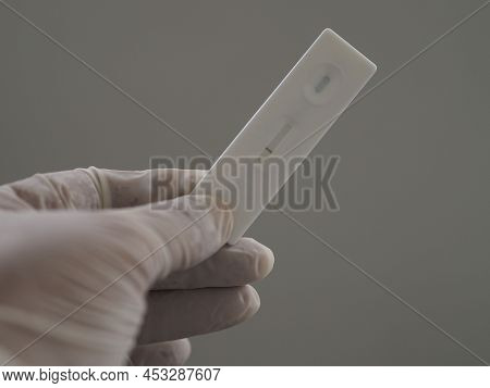 Asian Woman Wear Rubber Gloves Hold Atk Antigen Test Kit Covid-19 Virus Test