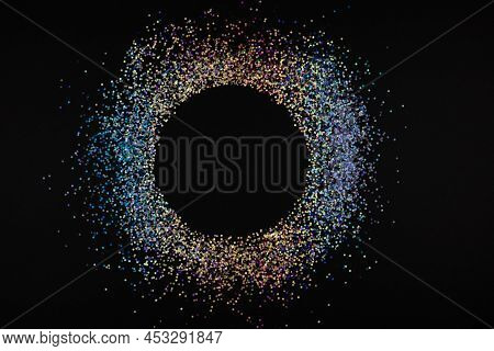 Multicolored Neon Glitter Circle With Copyspace On Black Backgroung
