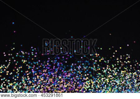 Multicolored Neon Glitter Sparkling On Black Background.
