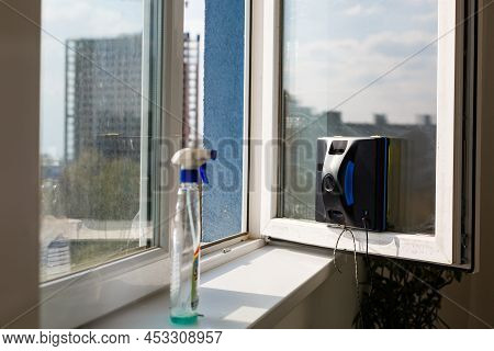 Detail Of A Glass Cleaning Robots Acting Behind A Window