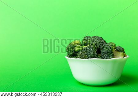 Broccoli Of Fresh Green Broccoli In Bowl Over Coloredbackground. , Close Up. Fresh Vegetable.