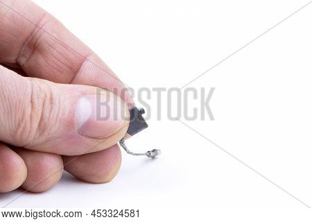 Used Carbon Brushes In Hand Isolated On A White Background. Brushes For Electric Motor.spare Parts F