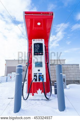 Rocky View County Alberta Canada, April 20 2022: Ice An Snow Covered Petro Canada Fast Charge Ev Cha