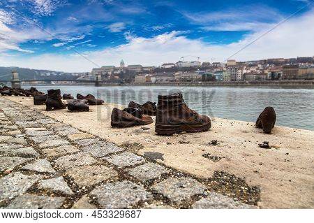 Shoes Symbolizing The Massacre Of People Shot At The River Danube In Budapest In A Winter Day
