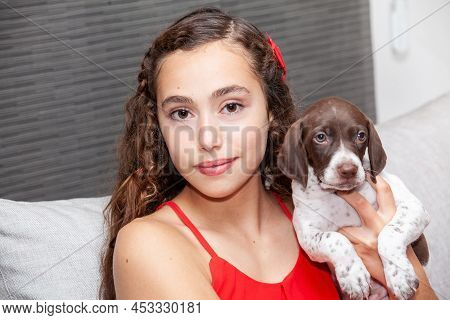 Beautiful Young Girl With Her Small French Braque Puppy