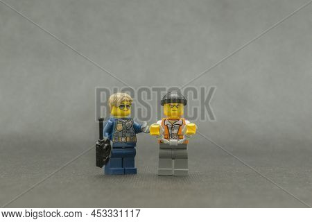 Bauru, Brazil. September 15, 2019: Lego Minifigure Of Thief In Handcuffs With Police Escorting. The 