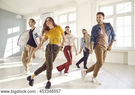 Group Of Happy Young People Having A Contemporary Dance Class In A Modern Studio