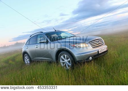 Novyy Urengoy, Russia - June 23, 2020: Luxury Crossover Infiniti Fx35 In A High Grass.