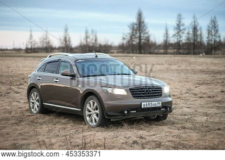 Novyy Urengoy, Russia - May 29, 2021: Old Japanese Crossover Infiniti Fx45 In A Dry Grassland.