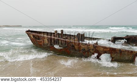 View Of A Rusty Shipwreck In Habonim Beach In Stormy Day.  Habonim Shore, Israel