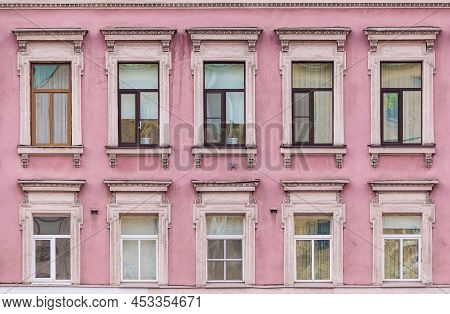 Many Windows In A Row On The Facade Of The Urban Historic Apartment Building Front View, Saint Peter