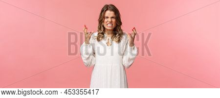 Portrait Of Woman Losing Control Over Emotions, Feel Pressured And Tensed, Lose Temper, Clench Hands