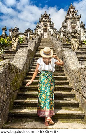 Woman Traveler At Ancient Gate At Pura Penataran Agung Lempuyang Temple On Bali, Indonesia