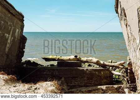 Ruins Of Bunkers On The Beach Of The Baltic Sea, Part Of An Old Fort In The Former Soviet Base Karos
