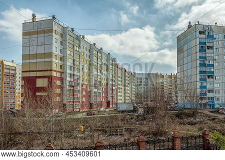 Urban Landscape, Multi-storey Residential Buildings Against The Background Of A Cloudy Sky. The Phot