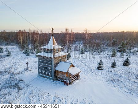 Temple Of Simon Okhtinsky And Andrei Ufimsky. Small Wooden Church On Anninsky Churchyard. Winter Eve