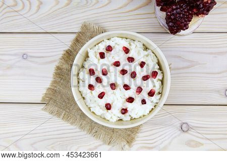 Curd Rice In A Bowl. A Popular Dish From South India With Rice, Yogurt, Spices, Pomegranate. Top Vie