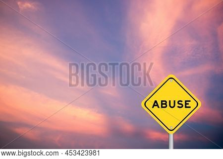Yellow Transportation Sign With Word Abuse On Violet Color Sky Background