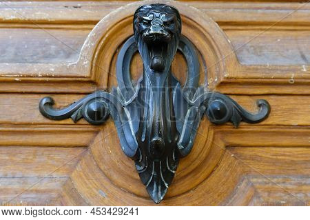 European Vintage Old Metal Wrought Iron Door Knocker. Design Detail. Paris.