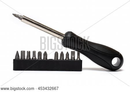 Close-up Of A Flexible Screwdriver With Various Bits With Black Rubberized Handle On White Backgroun
