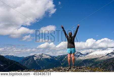 Strong Woman Looks Out Over North Cascades Wilderness