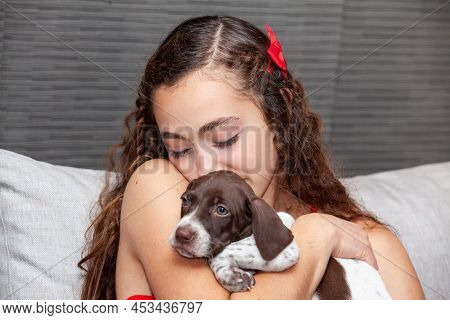 Beautiful Young Girl Dressed In Red With Her Small French Braque Puppy