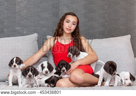 Beautiful Young Girl Dressed In Red With Her Small French Braque Puppy