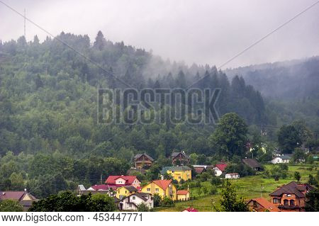 Houses In The Valley In The Ukrainian Carpathians At Foggy Weather