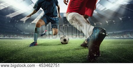 Cropped Image Of Two Soccer, Football Players In Motion, Action At Stadium During Football Match. Co