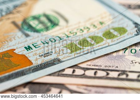 Fragment Of Hundred Dollar Note. Close-up American Paper Currancy. Selective Focus. New Us Paper Ban